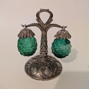 Price Imports Salt & Pepper. Green 'pineapple' hanging vessels.